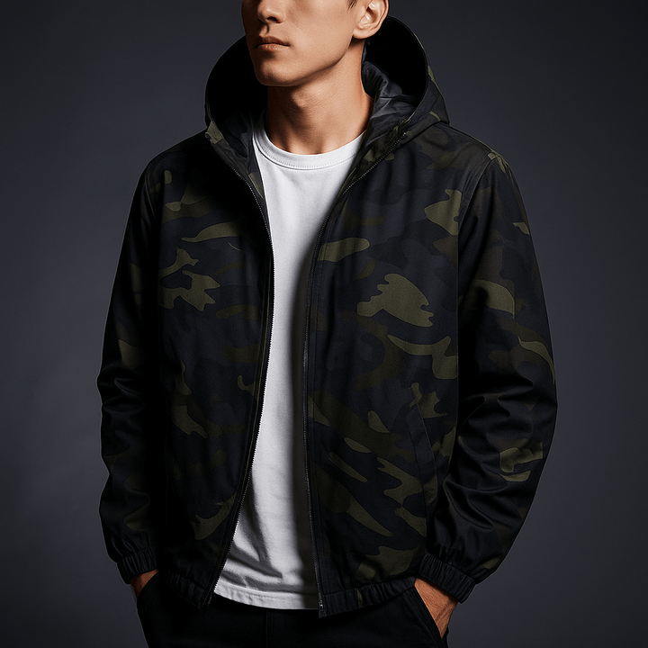 Person wearing a black camouflage jacket over a white shirt on a dark background