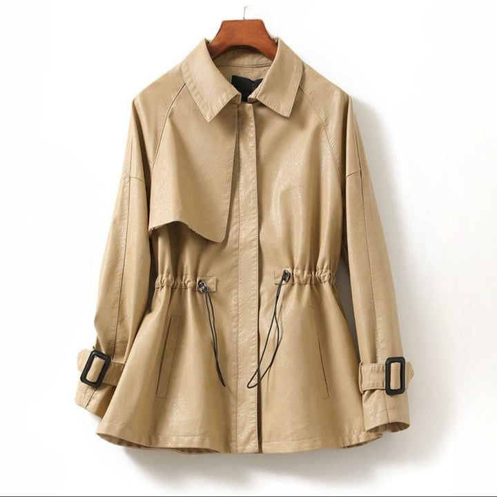 Beige trench coat on a wooden hanger against a white background